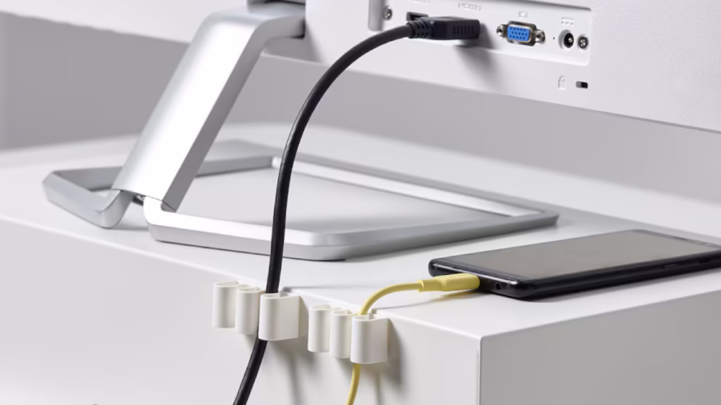 Alex’s cable holders desk setup with organized cables.