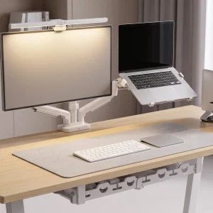 Advanced dual monitor and laptop executive desk setup kit in minimalist white and silver featuring white dual gas strut arm, silver CNC vertical laptop stand, white screen light bar, and light gray desk mat
