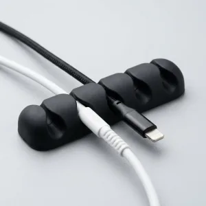 Cable Holder Clips for Cord Management: Black adhesive silicone clips routing thin cables seamlessly